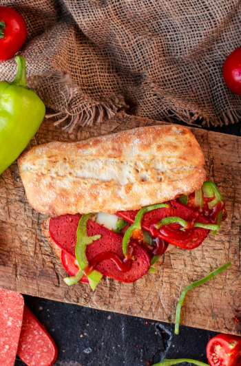 Baguette  sandwich with sucuk and vegetables, top view Free Photo