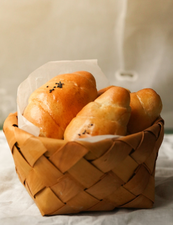 Baked Bread Served on Basket Baked Bread Served on Basket