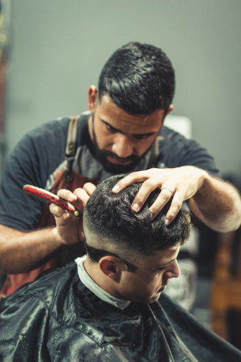 Barber Cutting Person's Hair Barber Cutting Person's Hair
