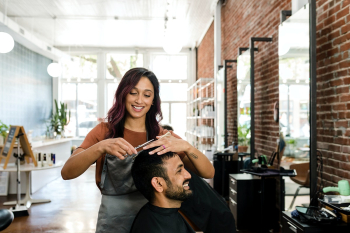 Barber trimming a customer's hair at a barber… | Free stock photo | High Resolution image