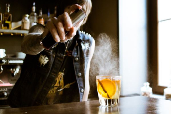 bartender holding spray bottle bartender holding spray bottle