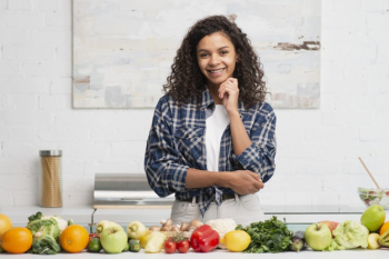 Beautiful afro american woman posing next to vegetables Free Photo Beautiful afro american woman posing next to vegetables Free Photo