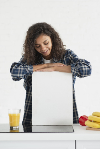 Beautiful woman looking at mock up sign Free Photo