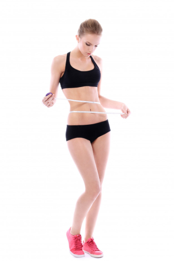 Beautiful woman measuring her waistline Free Photo Beautiful woman measuring her waistline Free Photo
