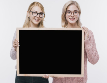 Beautiful young girls together with mock-up Free Photo