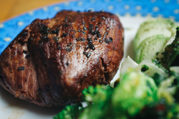 Beef steak with black salt close up Beef steak with black salt close up