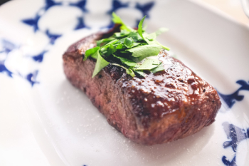 Beef steak with herb and salt close up Beef steak with herb and salt close up