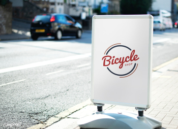 Bicycle shop sign on the street of the city | Free stock psd mockup - 527062