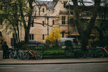 Bicycles Parked Near a Fence Bicycles Parked Near a Fence