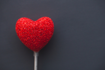 Big red heart on dark background Big red heart on dark background