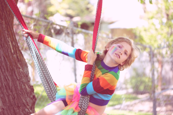 Bink, a gender non-conforming 10 year old child playing outside. Bink, a gender non-conforming 10 year old child playing outside.