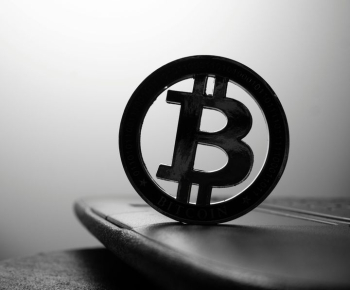 Bitcoin Symbol on Laptop Surface Bitcoin Symbol on Laptop Surface