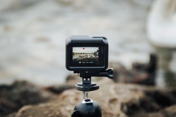 black action camera on tripod black action camera on tripod