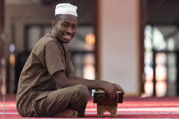 Black African Muslim Man Reading Holy Islamic Book Koran