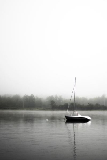 black and white boat on lake black and white boat on lake