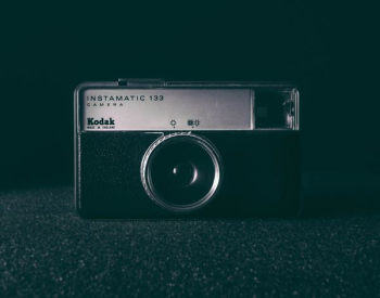 black and white camera on black surface black and white camera on black surface
