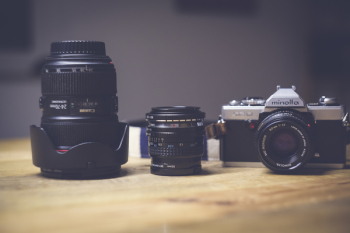 Black and White Dslr Camera Lens Beside Black Lens Black and White Dslr Camera Lens Beside Black Lens