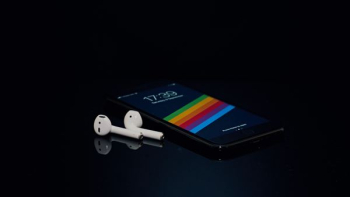 black Android smartphone and Apple AirPods black Android smartphone and Apple AirPods