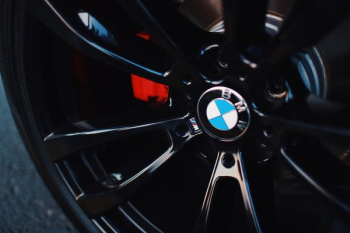 black BMW 5-spoke vehicle wheel with tire black BMW 5-spoke vehicle wheel with tire