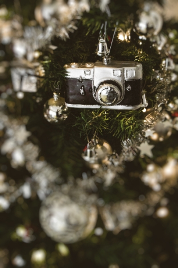 Black Camera Hanged on Christmas Tree Black Camera Hanged on Christmas Tree