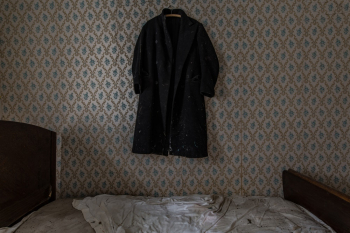 Black Coat Hanging on Wall Black Coat Hanging on Wall