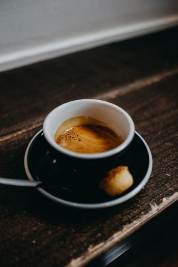 black cup filled with coffee