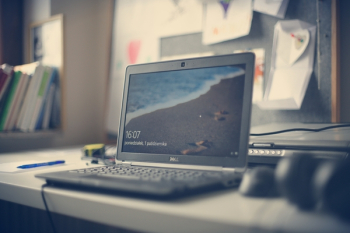 Black Dell Laptop on White Desk Black Dell Laptop on White Desk