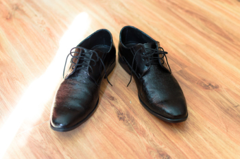 Black Leather Shoes on Flooring Black Leather Shoes on Flooring
