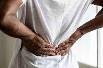 Black man suffering back pain Black man suffering back pain