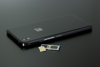 Black Smartphone on Black Table Top Black Smartphone on Black Table Top