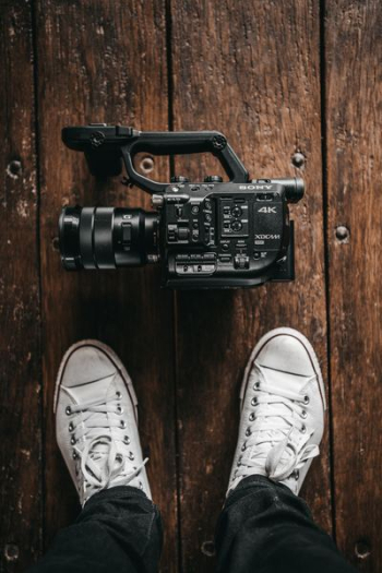 black Sony videocamera on floor black Sony videocamera on floor