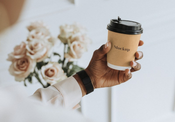 Black woman holding a paper | Free PSD Mockup - rawpixel