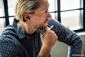 Blond man busy at work Blond man busy at work