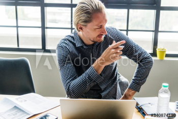 Blond man busy at work Blond man busy at work