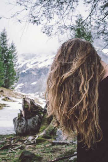 blonde-hair woman covering her face with hair blonde-hair woman covering her face with hair