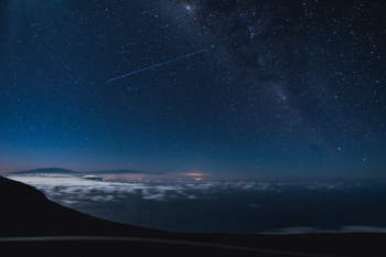 blue and black sky with stars and falling star at nighttime blue and black sky with stars and falling star at nighttime