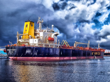 Blue and Grey Cargo Ship Navigating Blue and Grey Cargo Ship Navigating
