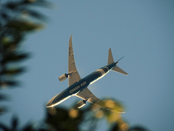 Blue and White Airplane on Mid Air Blue and White Airplane on Mid Air