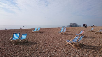 blue and white wooden chairs near seaside blue and white wooden chairs near seaside