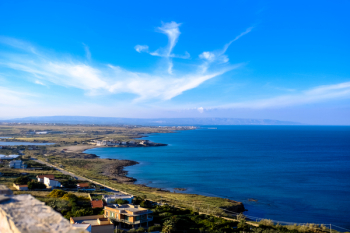 Blue Calm Body of Water Under Blue and White Sky Blue Calm Body of Water Under Blue and White Sky