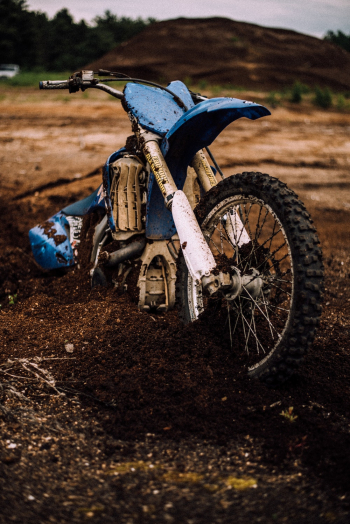 Blue Motocross Dirt Bike on Mud Blue Motocross Dirt Bike on Mud