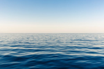 blue ocean water during daytime blue ocean water during daytime