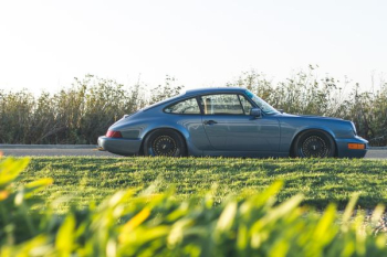 blue Porsche 911 parked beside road blue Porsche 911 parked beside road