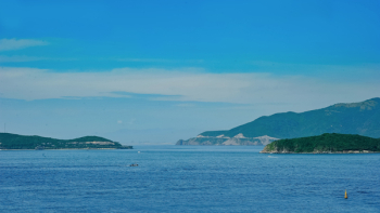 Blue Sea Near Mountains Blue Sea Near Mountains