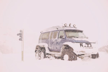 blue SUV covered with snow blue SUV covered with snow
