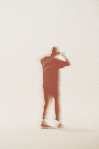 Blurred Walking Person on White Background