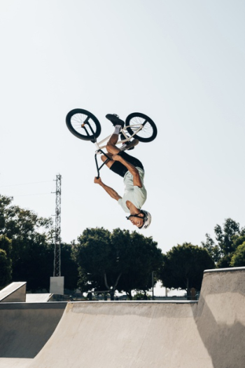 Bmx rider jumping upside-down Free Photo