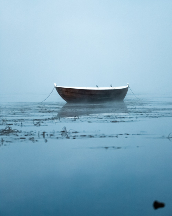 Boat Anchored in Water Boat Anchored in Water