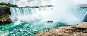 Boat Beside Waterfalls Boat Beside Waterfalls