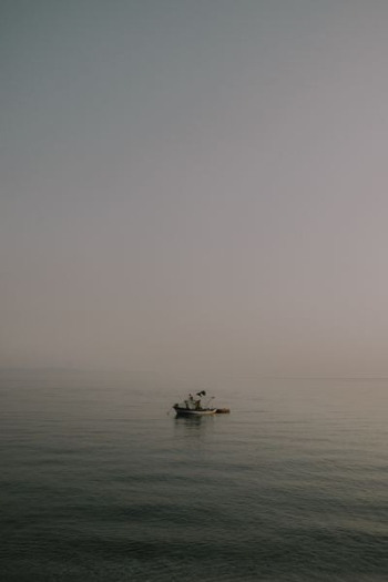 boat on body of water boat on body of water